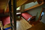 A view of the kids` beds from the playloft in that room.  